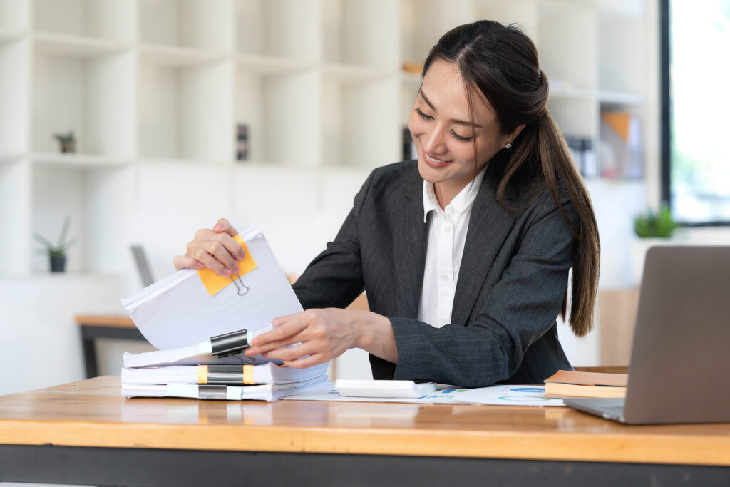 Business Documents, Auditor businesswoman checking searching document legal prepare paperwork or report for analysis TAX time, accountant Documents data contract partner deal in workplace office