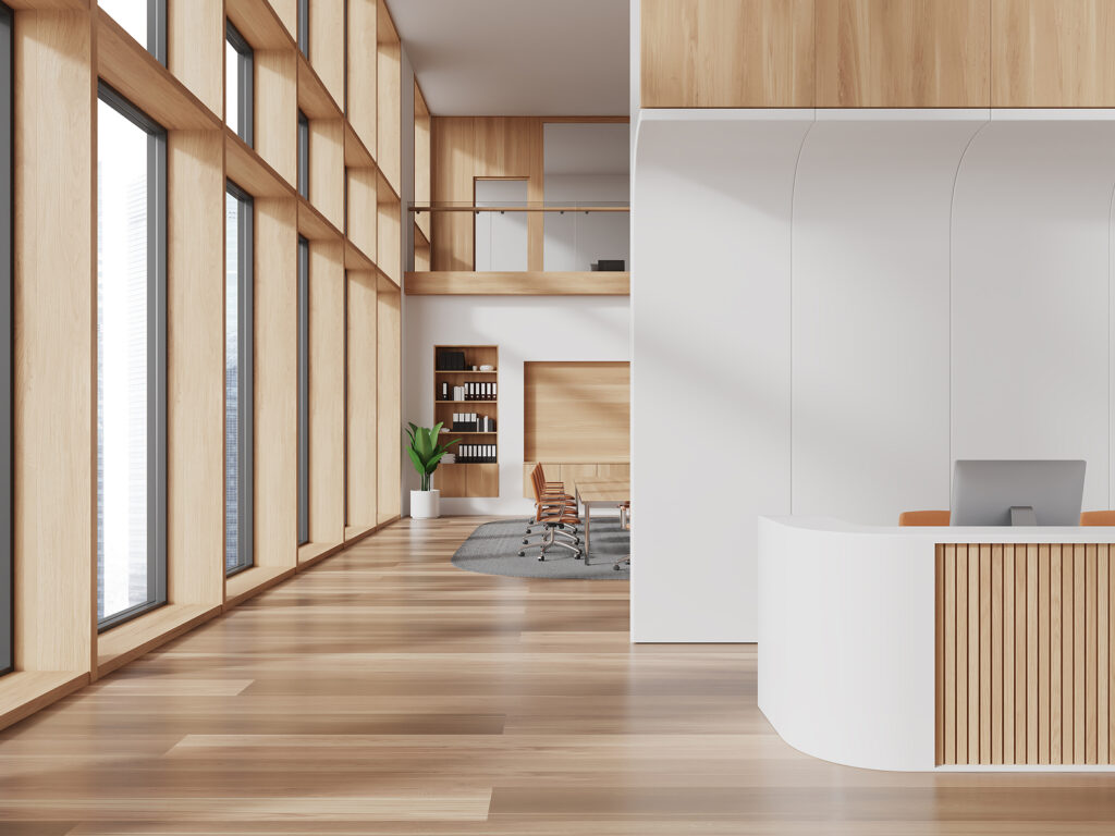 Interior of modern office with white and wooden walls, wooden flooring. Beautiful clean office floors